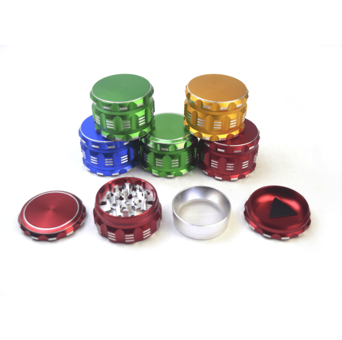A top-down view of the 4 Piece Aluminum Drum Shape Grinder in a variety of metallic colors, arranged in a circular pattern.