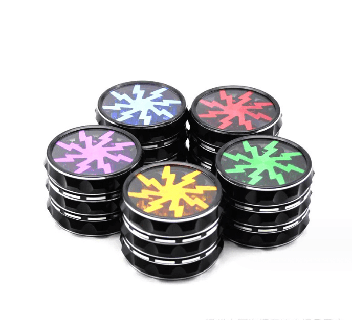 A top-down view of the 4 Piece Aluminum Lighting Teeth Grinder, featuring four metallic grinders arranged in a square pattern.