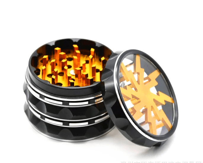 A top-down view of the 4 Piece Aluminum Lighting Teeth Grinder, revealing internal metal teeth within its open, cylindrical form.