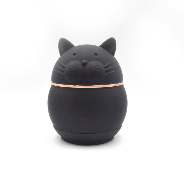 Front view of the Cute Animal Aluminum Grinder, a dark-colored, compact cylindrical object against a plain white background.