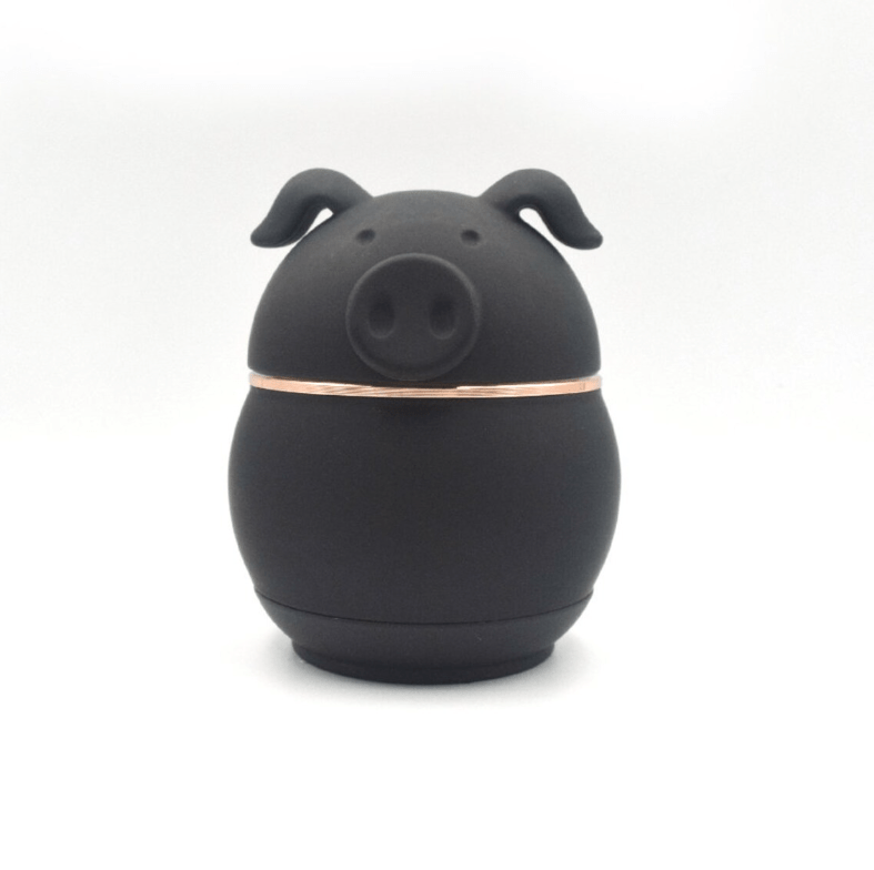 Front view of the Cute Animal Aluminum Grinder, a dark-colored, rounded device resembling a cartoon animal.