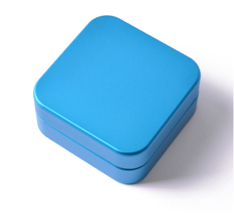 Top-down view of the 2 Piece Aluminum Square Grinder, showcasing its polished silver finish and square shape.