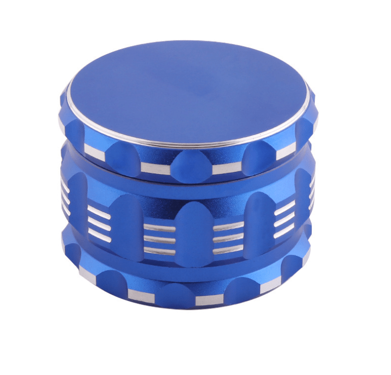 A close-up, angled view of the 4 Piece Aluminum Drum Shape Grinder, showcasing its multi-tiered, cylindrical design.