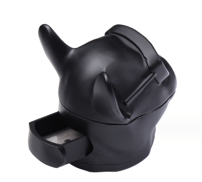 A close-up, angled view of the French Bulldog Grinder, showcasing its sleek, dark design and unique shape.
