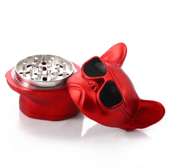 A close-up, angled view of the French Bulldog Grinder, showcasing its unique sculpted design and open grinding chamber.