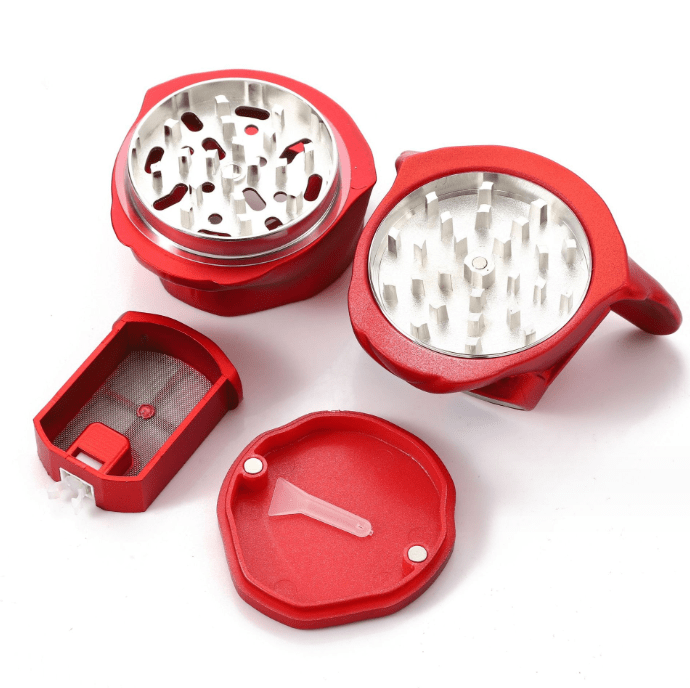 Overhead view of the open French Bulldog Grinder, revealing its multi-part metallic construction and internal grinding mechanism.