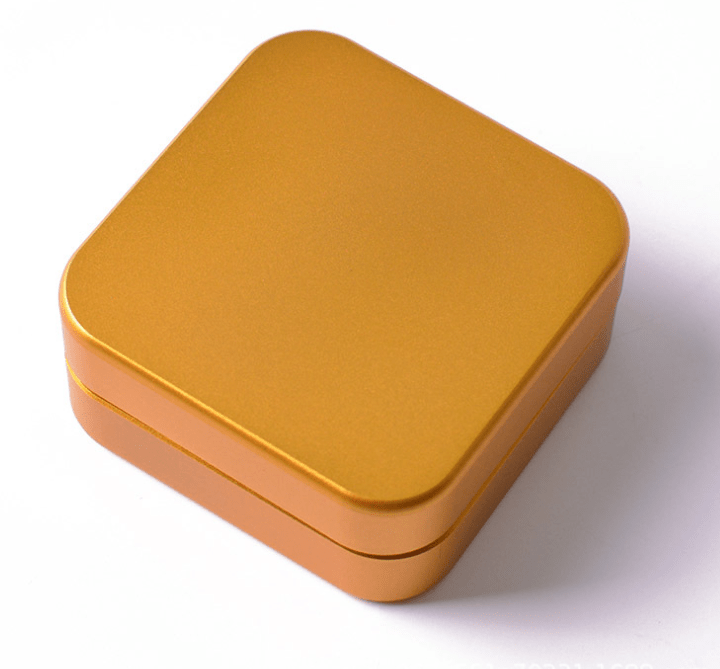 Top-down view of the 2 Piece Aluminum Square Grinder, showcasing its clean lines and metallic finish against a plain white background.