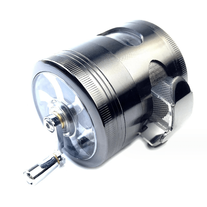 A detailed close-up of the 3.5" 4 Piece Hand Crank Grinder with Chamber Window, showing its metallic finish and clear viewing window.