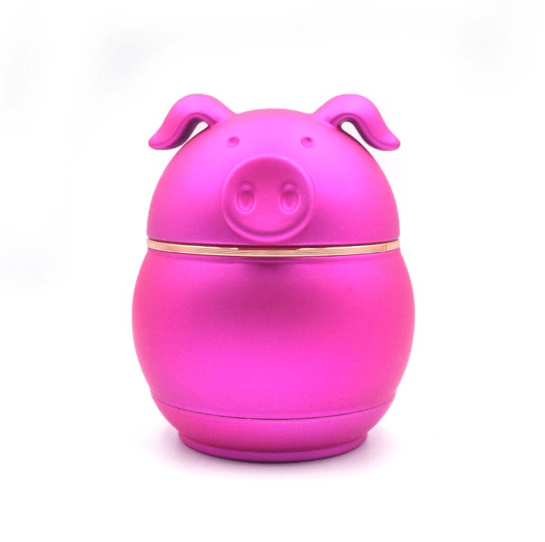 Front view of the Cute Animal Aluminum Grinder, a pink, rounded object resembling an animal’s head against a neutral background.