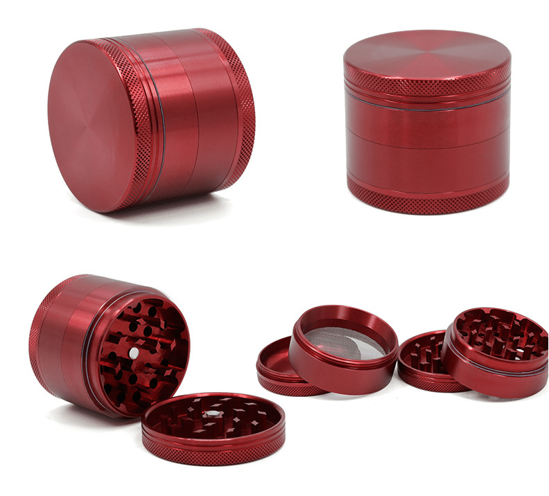 A disassembled view of the 4-Piece Aluminum Grinder, showing each circular, silver-toned piece separated on a neutral background.