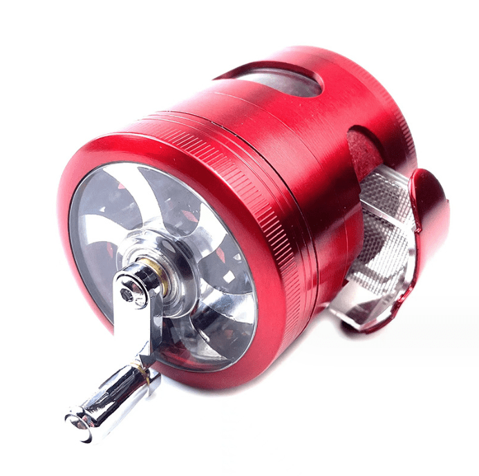 A detailed close-up of the 3.5" 4 Piece Hand Crank Grinder with Chamber Window, showcasing its metallic finish and visible grinding chamber.