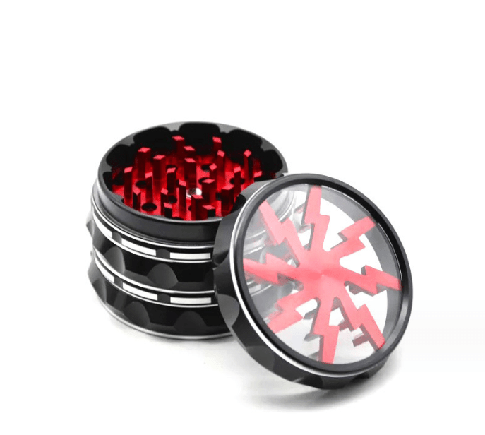 Close-up view of the 4 Piece Aluminum Lighting Teeth Grinder, showcasing its metallic teeth within the open grinder.