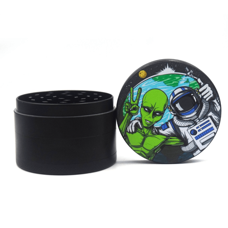 Top-down view of the 4 Piece 2.5" Trip to the Moon Grinder, displaying an outer design with a colorful space theme.