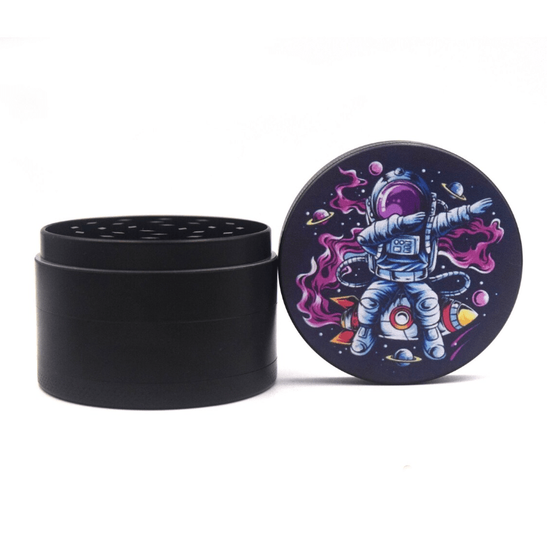 Front view of the 4 Piece 2.5" Trip to the Moon Grinder, displaying a colorful celestial design on its metallic body.