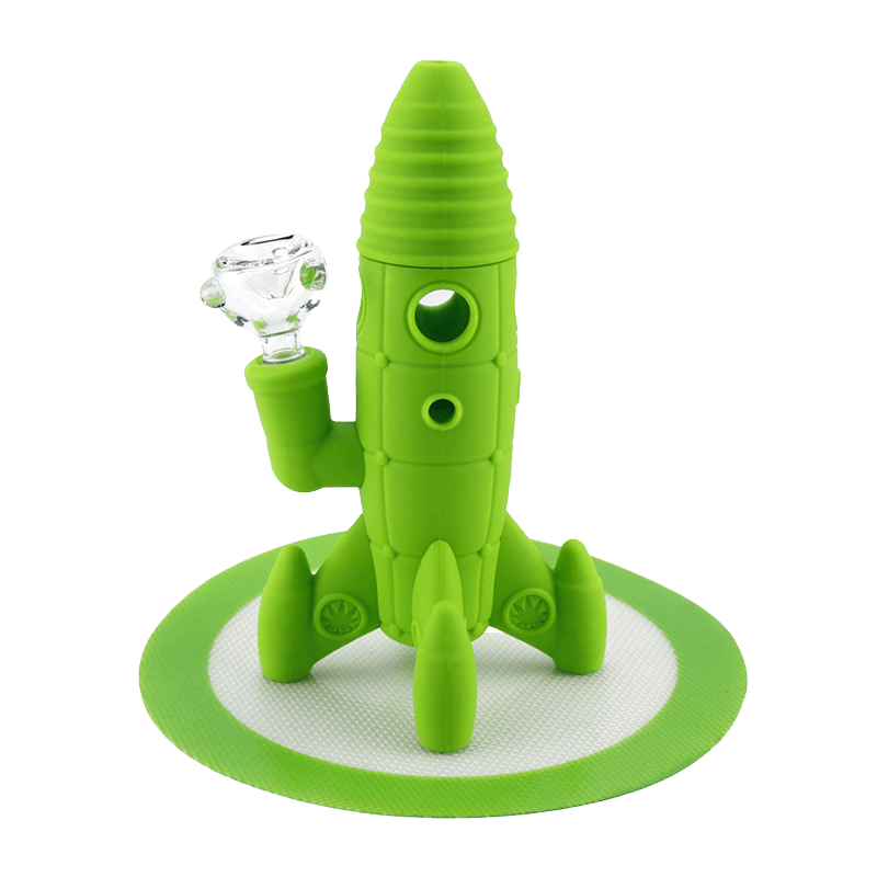 Front view of the Silicone and Glass Rocket Ship Mini Bong in bright green standing on a circular mat with a clear glass bowl attached.