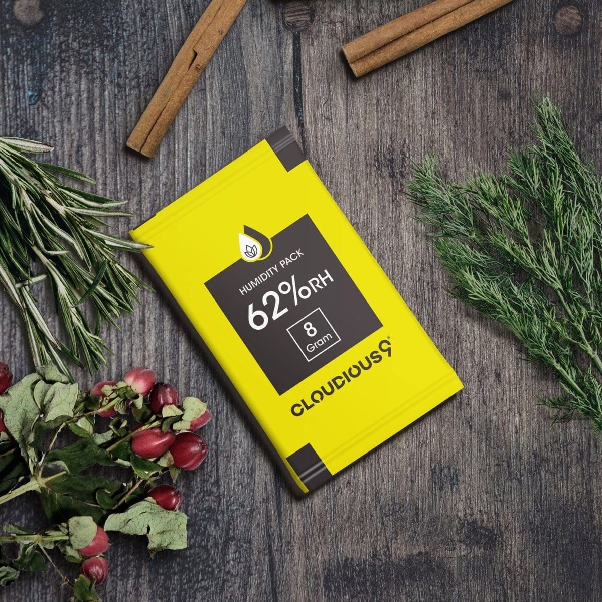 A close-up shows the Cloudious9 62% 2-Way Humidity Pack Regulator against a dark background with vibrant green leaves.