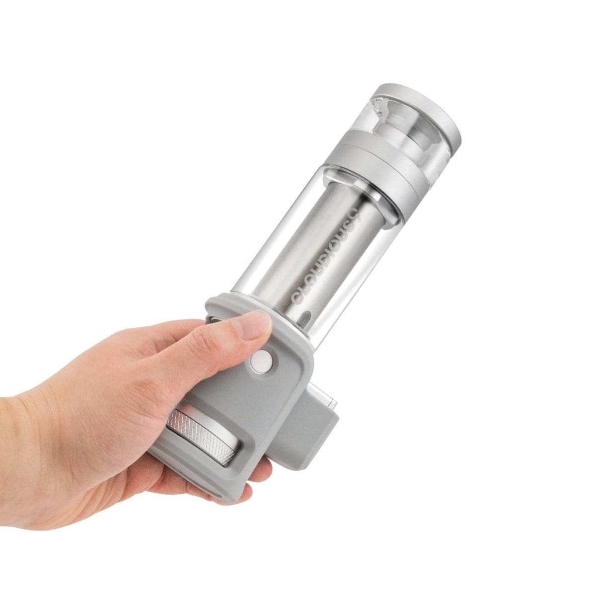 A hand holds the Cloudious9 Hydrology9 NX Flower & Concentrate Vaporizer, showcasing its metallic finish and sleek cylindrical design.