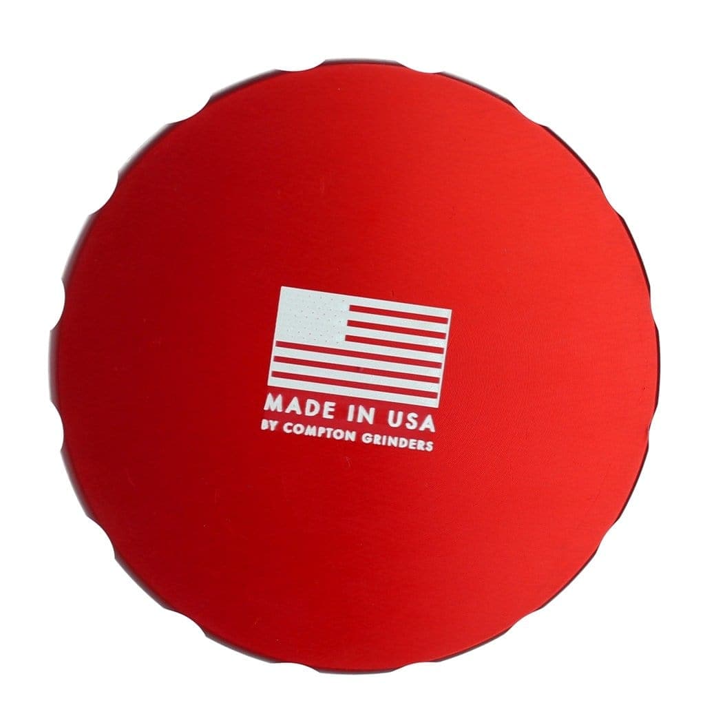 Front view of the Compton Vault, showcasing its cylindrical shape and smooth, red surface.