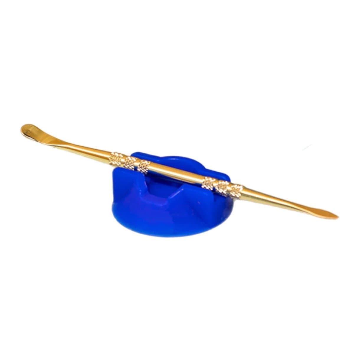 A close-up shows the V2 Dabber Dock® resting on a textured blue surface, highlighting its sleek, metallic design.