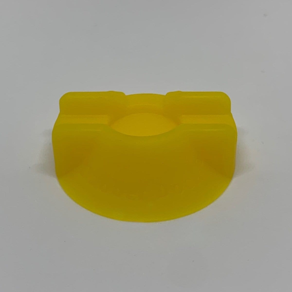 Close-up, top-down view of the V2 Dabber Dock®, a sleek, angled holder for dabbing tools against a plain white background.