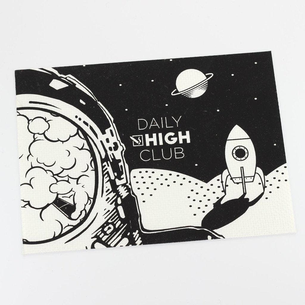 The DHC Originals "Space Time" Dab Mat features a cosmic design with a planet and stars surrounding a central circular space.
