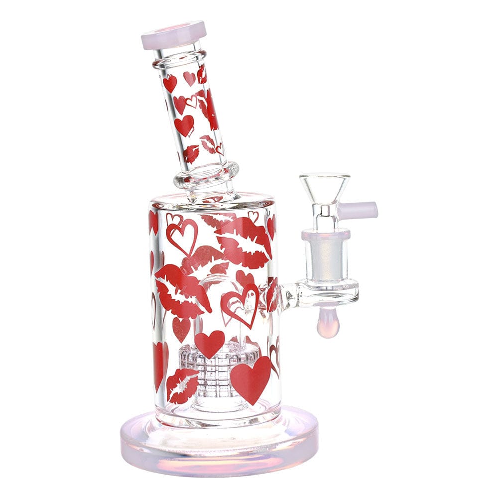 A studio shot of the 8" Lipstick Kiss Glass Water Pipe, displaying a pink-tinted glass with a pattern of kissing lips.