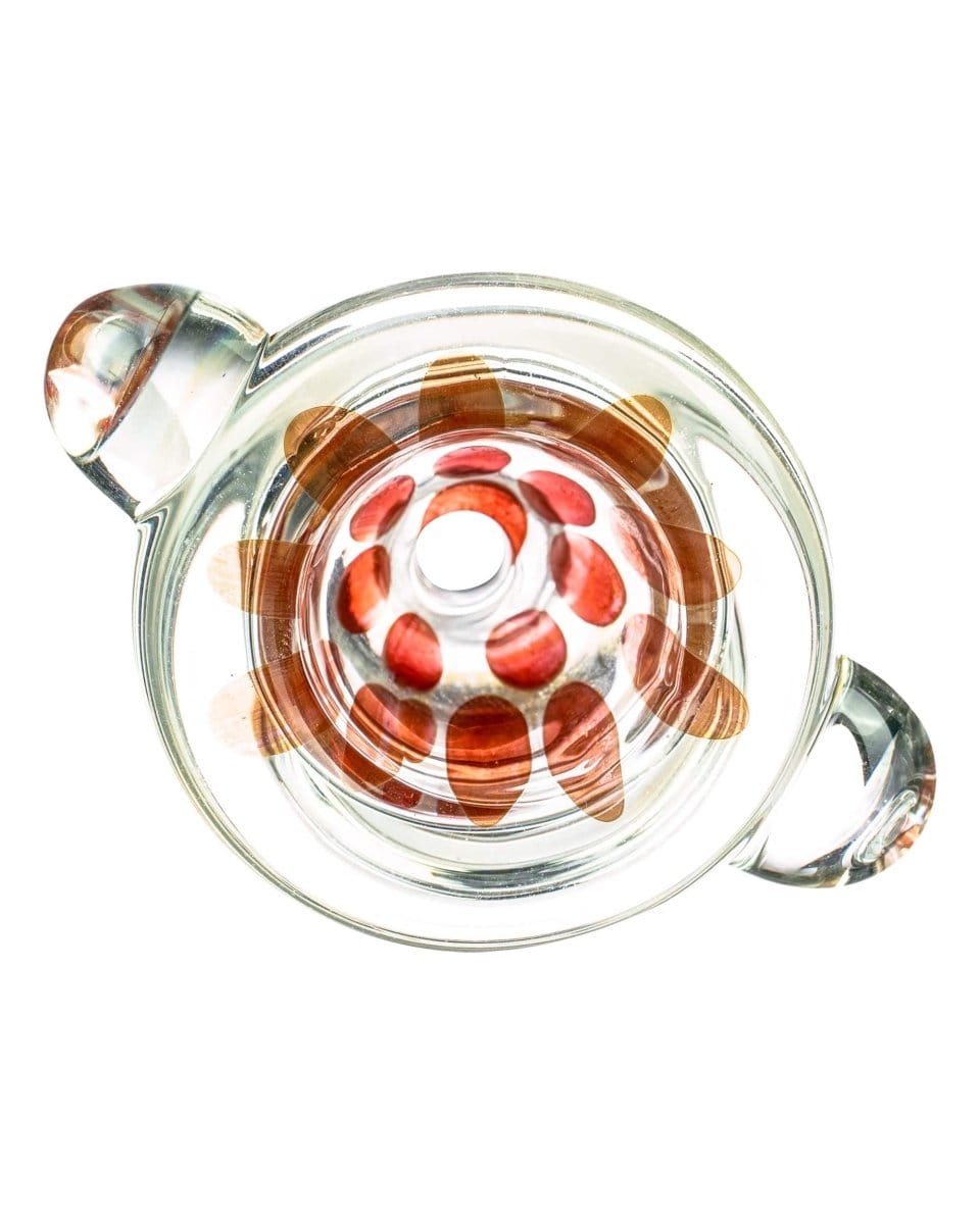A close-up, angled view of the Spotted Bubble Bowl, showing its clear glass construction and rounded shape.