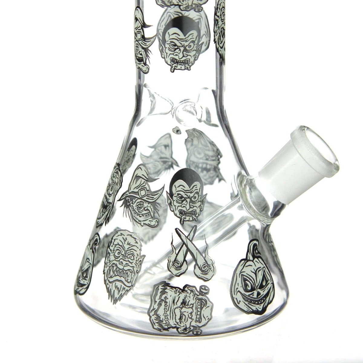 Front view of the DHC Originals "Monster Mash Beaker" Bong, a clear glass beaker featuring monster face illustrations.