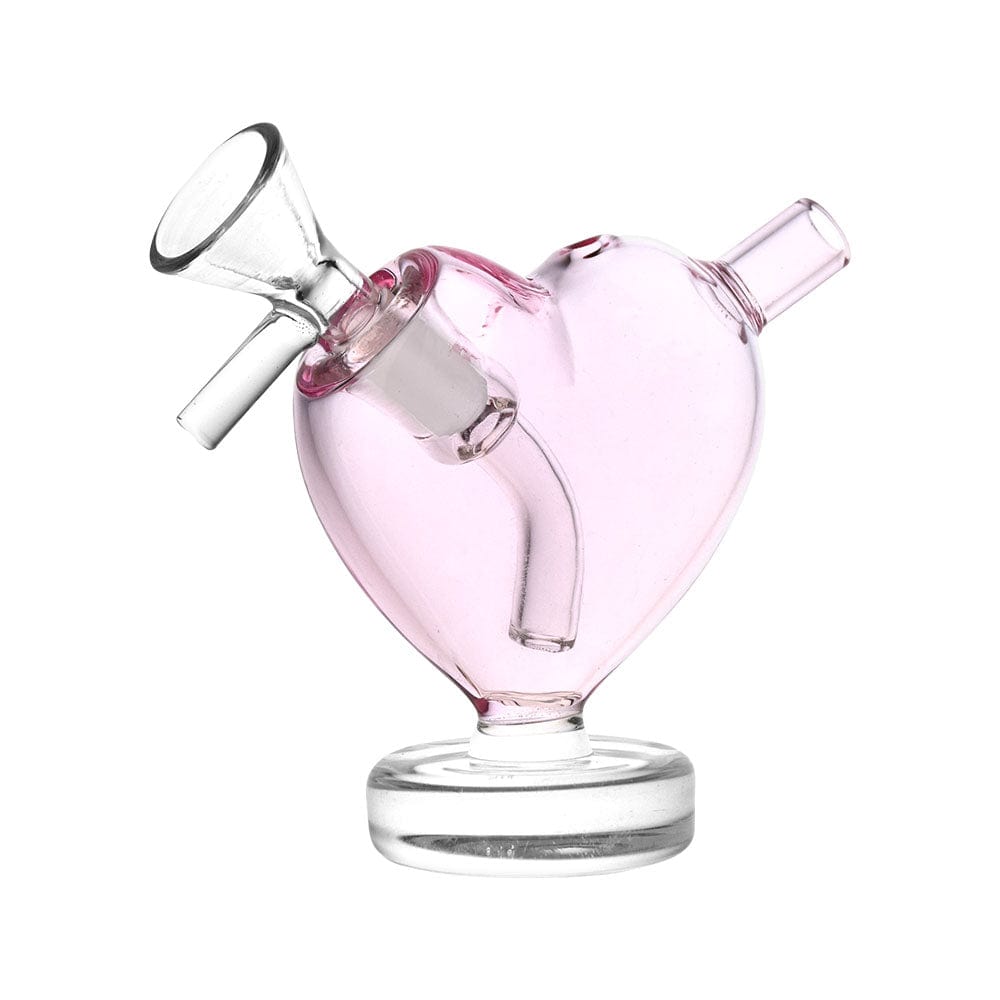 A close-up, angled view of the 3" From The Heart Glass Mini Bubbler, showcasing its clear glass construction and compact size.