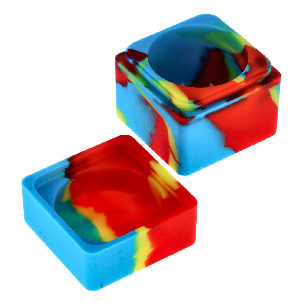 A slightly angled, top-down view of the Budder Buddy 60ml Silicone Container, showing its colorful, swirled design.