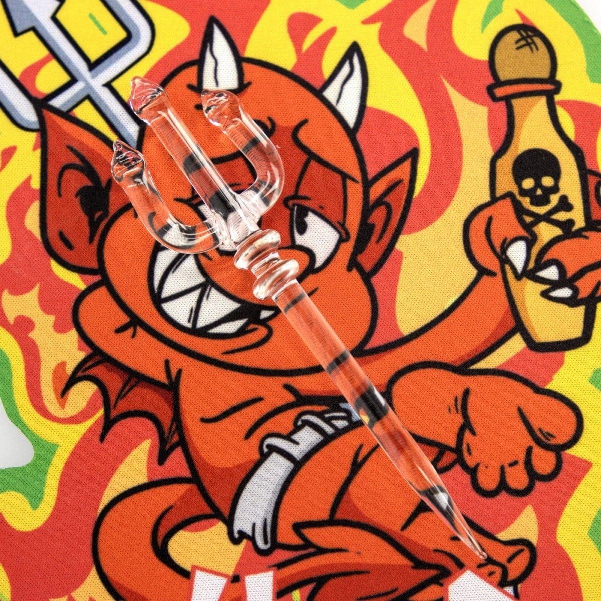 A vibrant, eye-level shot of the Devil Glass Mat for May, featuring a cartoon devil design with a textured background.