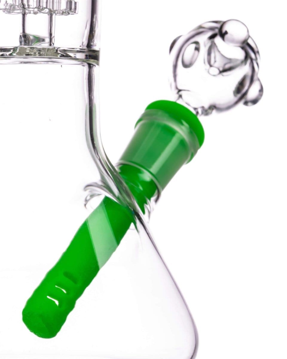 A close-up view of the 18mm to 14mm Silicone Downstem, showing its green silicone material and angled position within a glass joint.