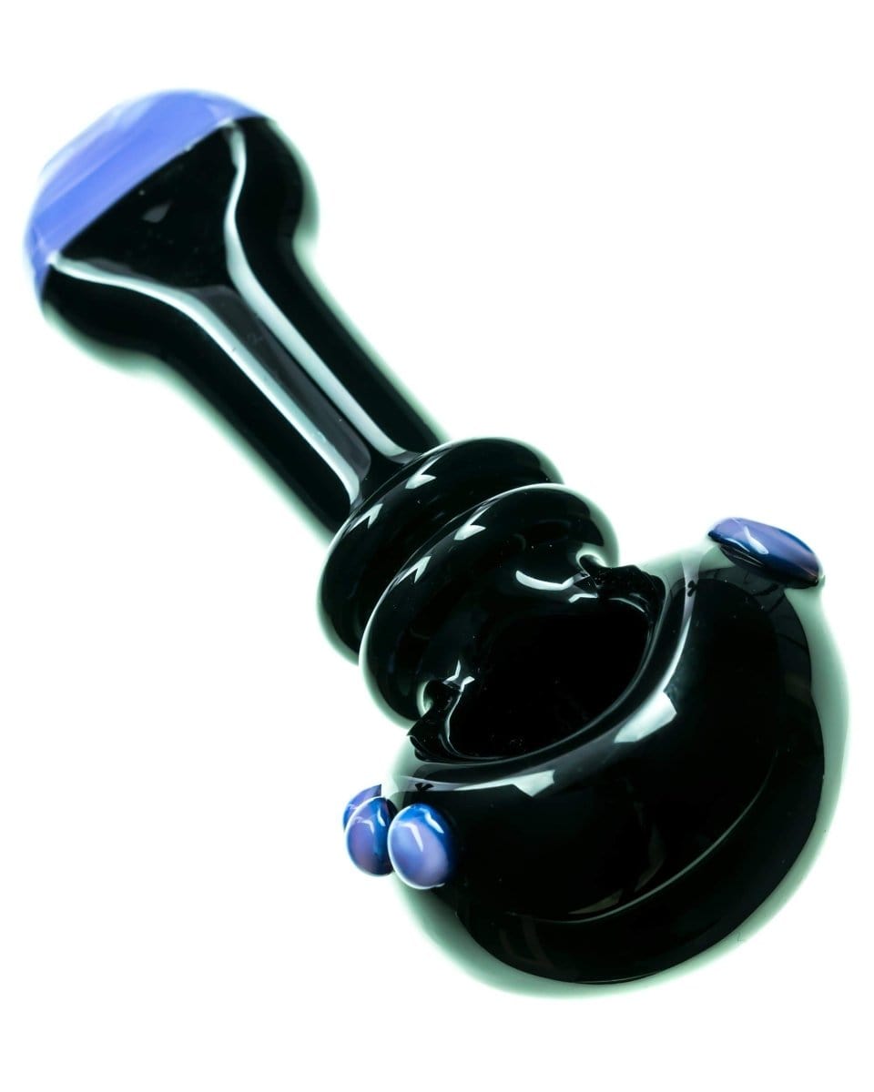 A close-up, angled view of the Maria Ring Spoon Pipe, featuring a dark, glossy finish and curved design.