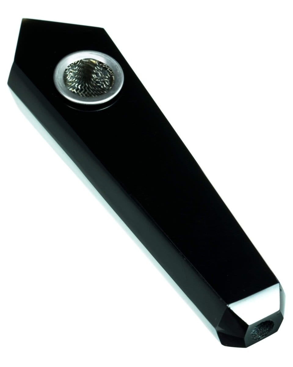 A close-up, angled view of the “Yin” Quartz Crystal Stone Pipe, showcasing its sleek, dark stone construction.
