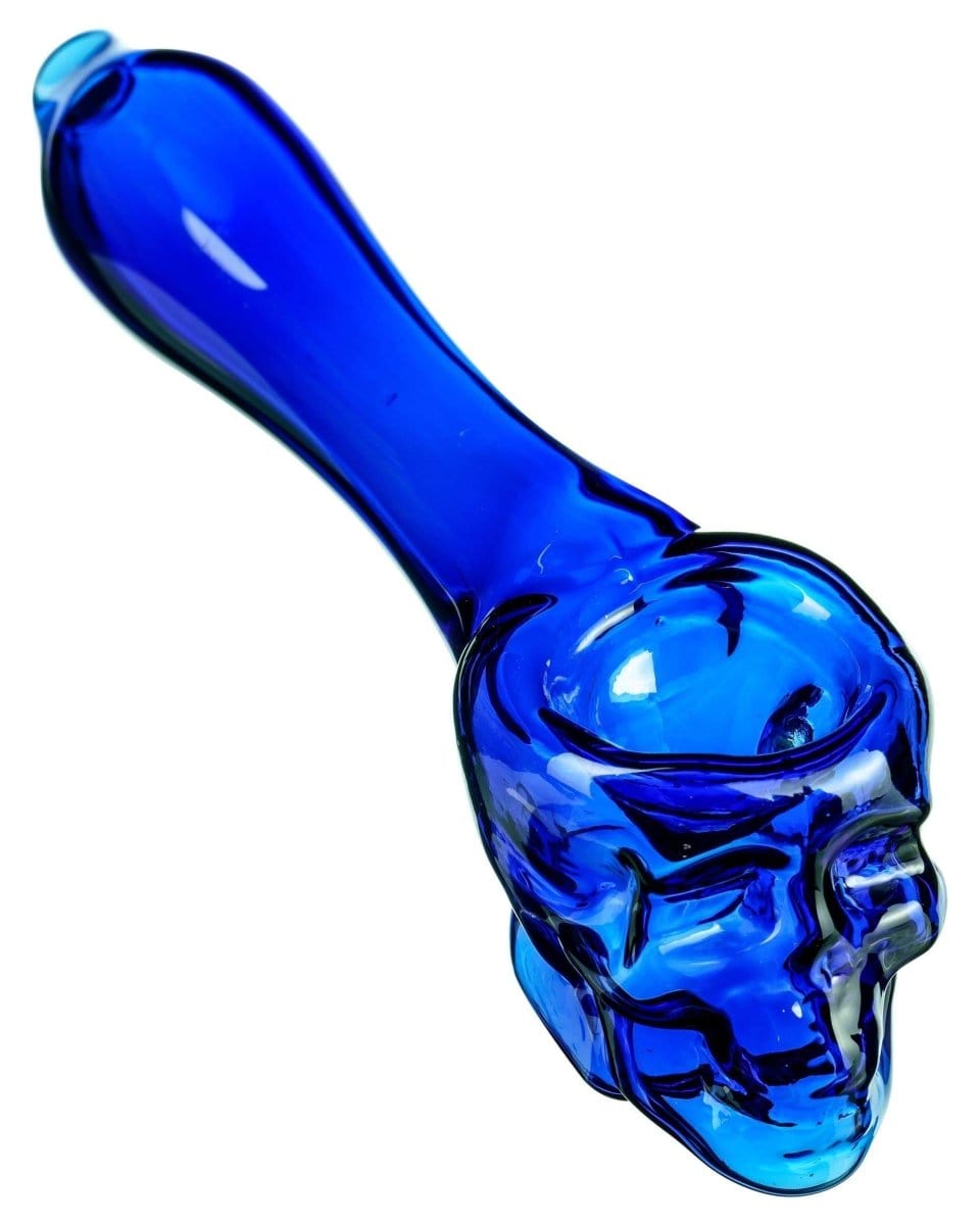 A studio shot of the Skull Mini Spoon Pipe, showcasing its sculpted, miniature design in vibrant blue glass.