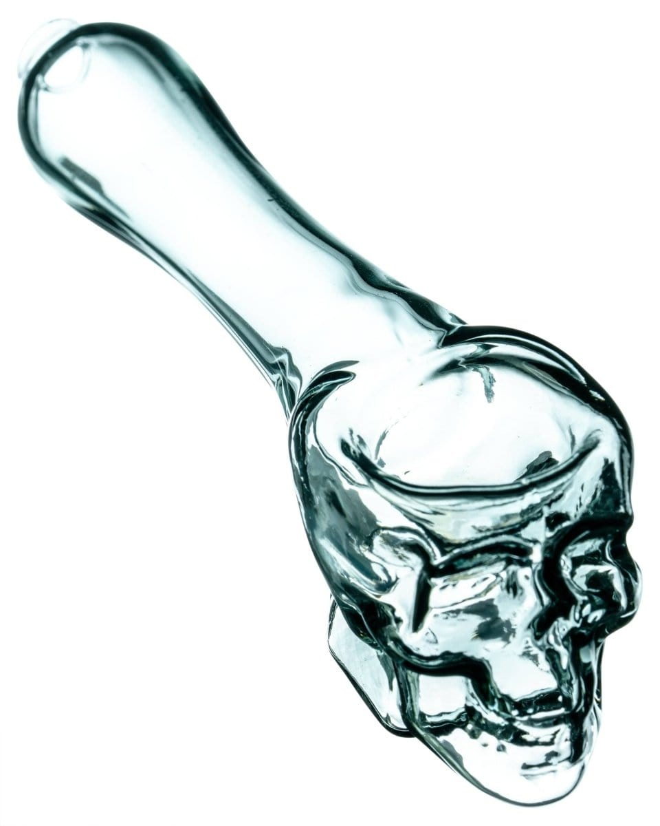 A close-up, side view of the Skull Mini Spoon Pipe, showcasing its detailed bone structure in clear glass.