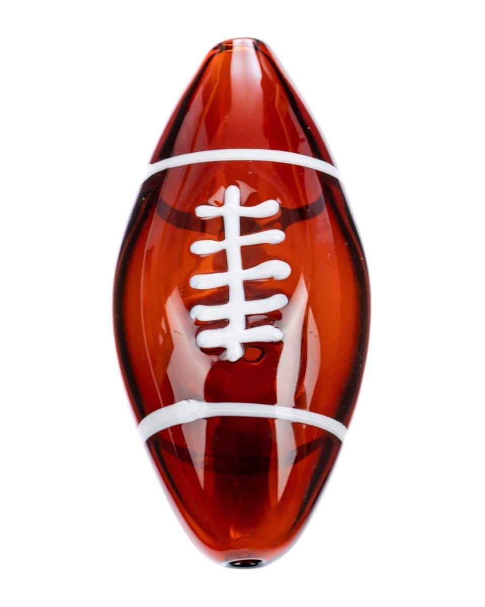 Front view of the Football Hand Pipe, a brown, football-shaped glass pipe against a plain white background.