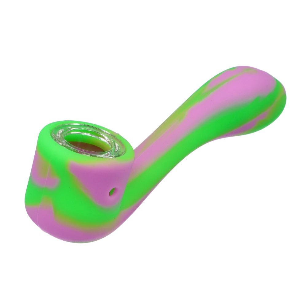 A close-up of the Silicone Sherlock Hand Pipe, showcasing its curved form and smooth, vibrant pink and green finish.