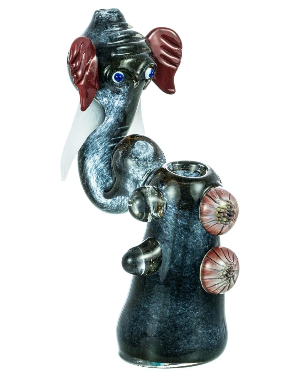 A front view of the Standing Elephant Head Bubbler, displaying its dark-colored glass sculpture with a textured head detail.