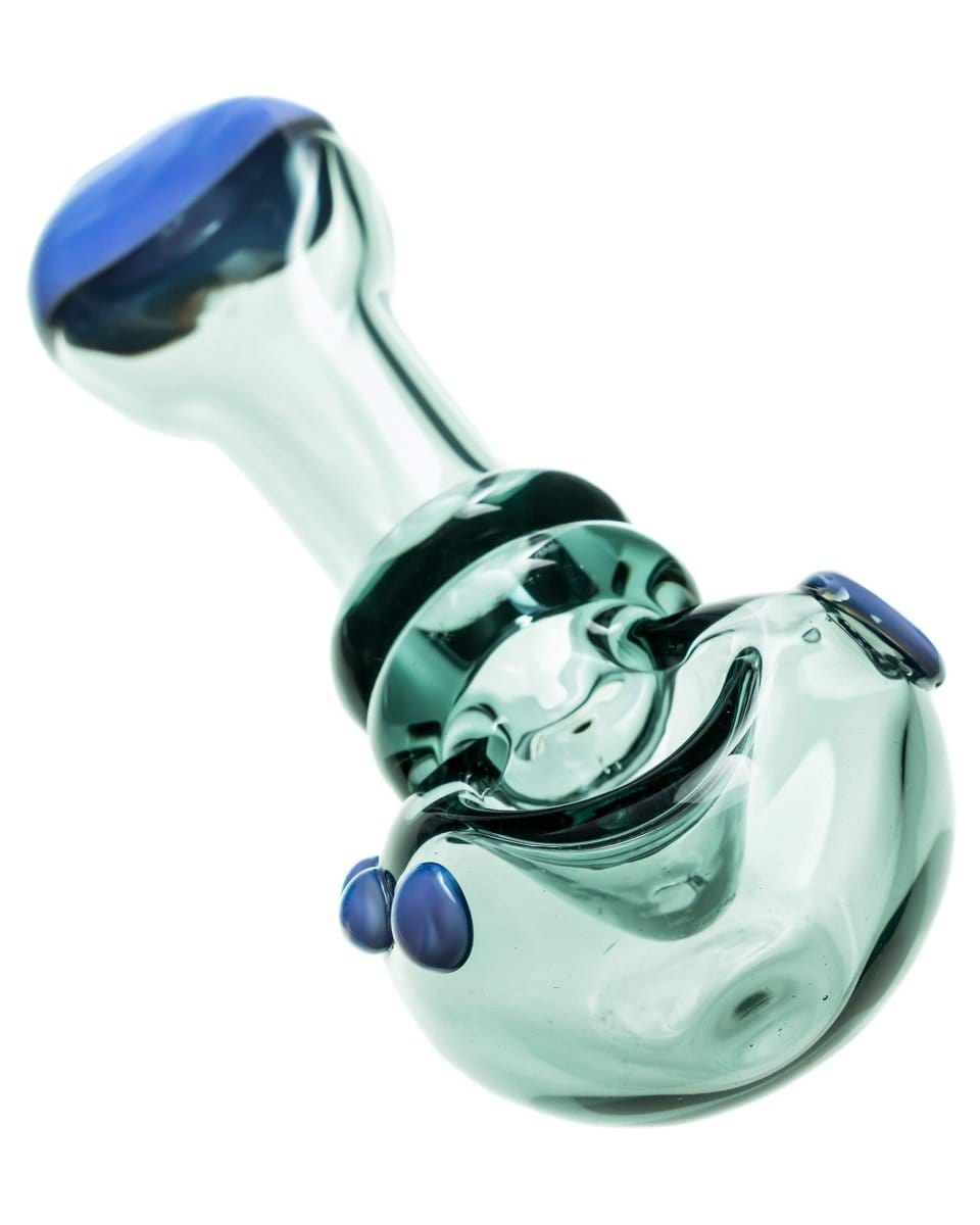 A close-up, angled view of the Maria Ring Spoon Pipe, showcasing its clear glass construction and curved design.