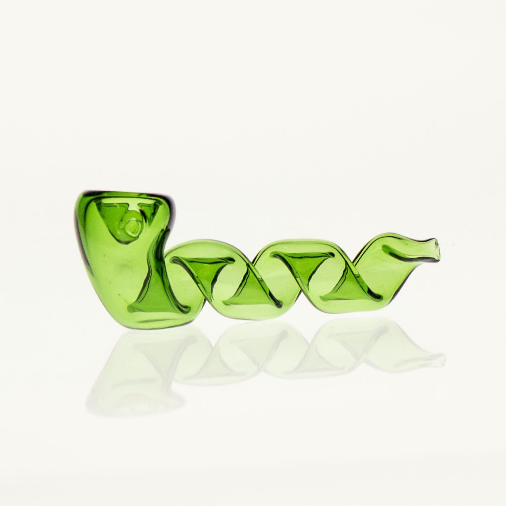 Close-up of the Twisted Pipe, a vibrant green glass pipe with a curved, sculptural design, displayed on a reflective surface.