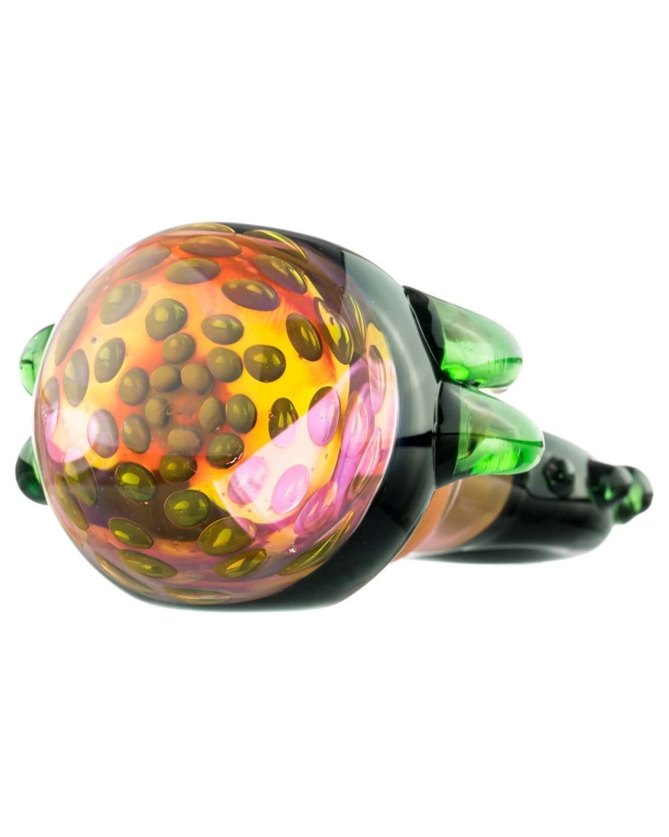 A side view of the “Ugly Monster” Spoon Pipe, featuring a colorful, speckled glass design.