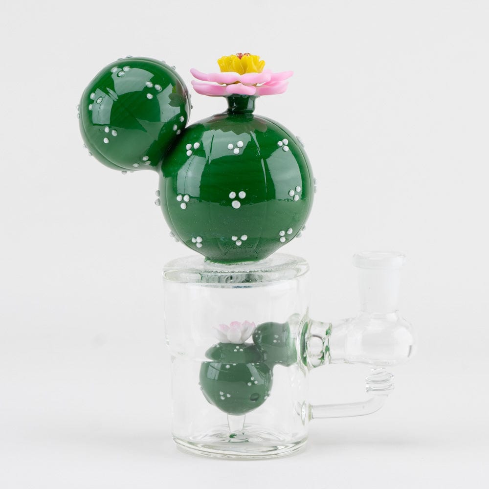 A studio shot of the Peyote Mini Rig, featuring a vibrant green glass rig with a unique bulbous shape and a clear base.