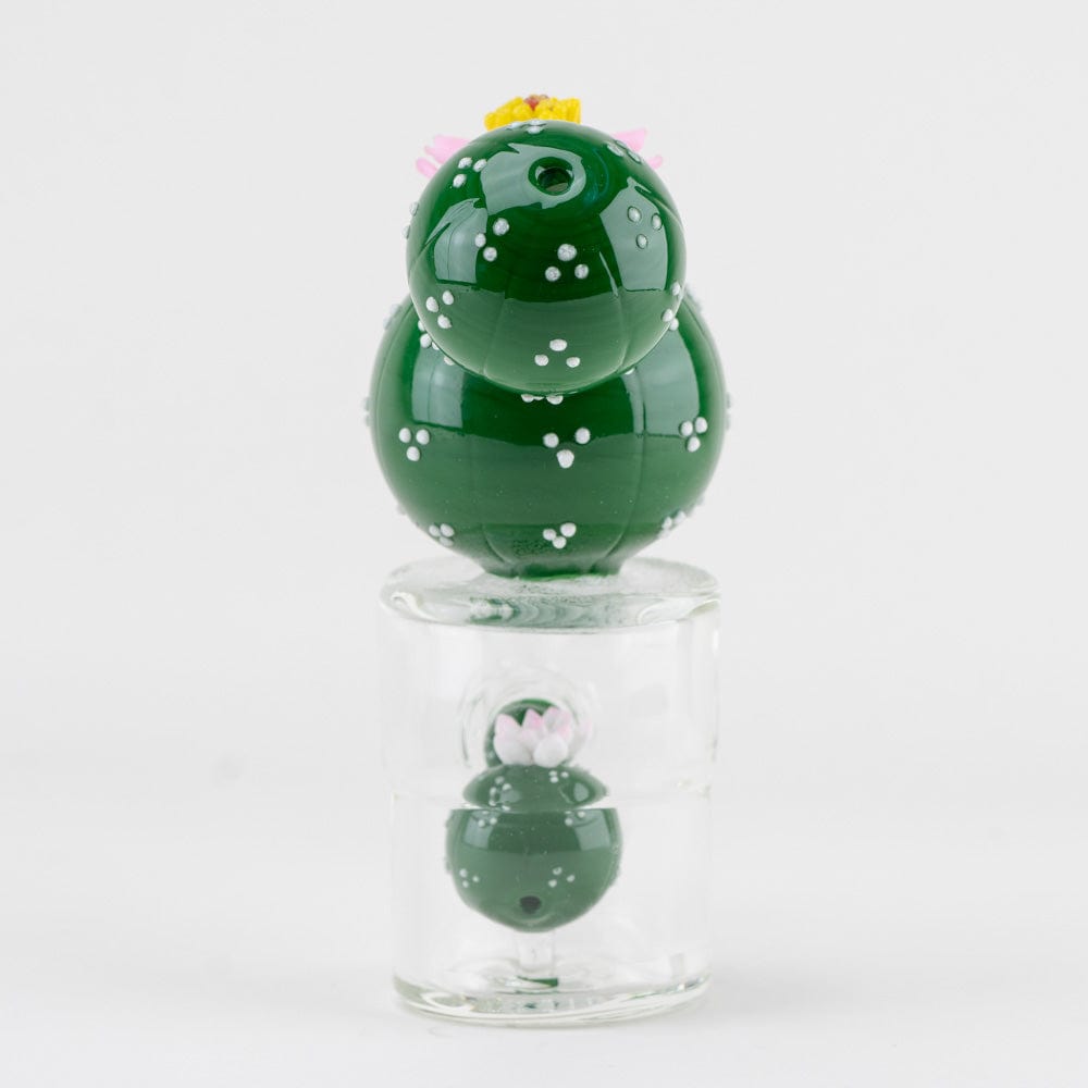 A studio shot of the Peyote Mini Rig, showing its rounded glass form and the reflection on its surface.