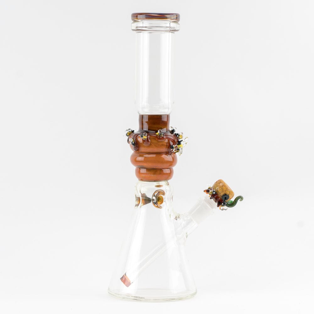Front view of the Save the Bee's Beaker, a clear glass beaker with a honeycomb-style accent near the top.