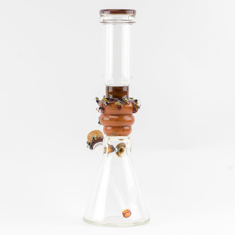 Front view of the Save the Bee's Beaker, a clear glass beaker with colorful accents near the neck and base.