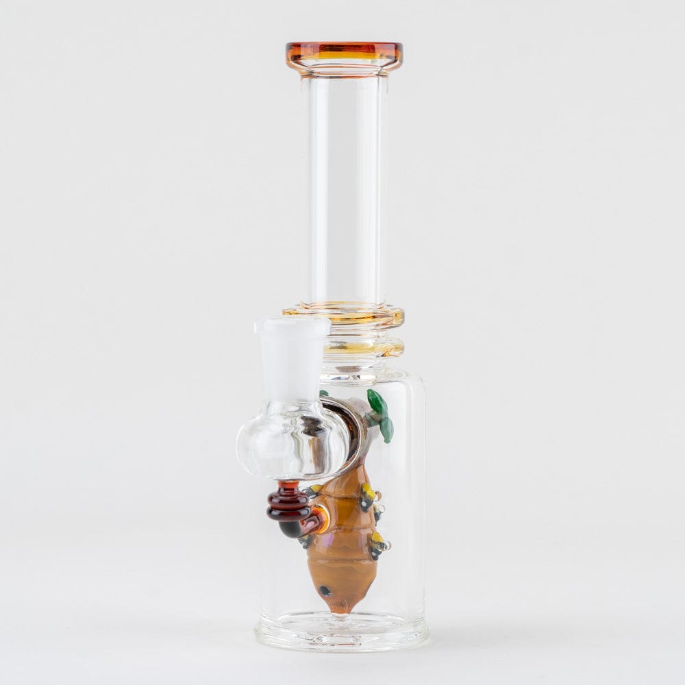 A front view of the “Save the Bees” Mini Tube, showing a clear glass tube with golden accents and a unique internal design.