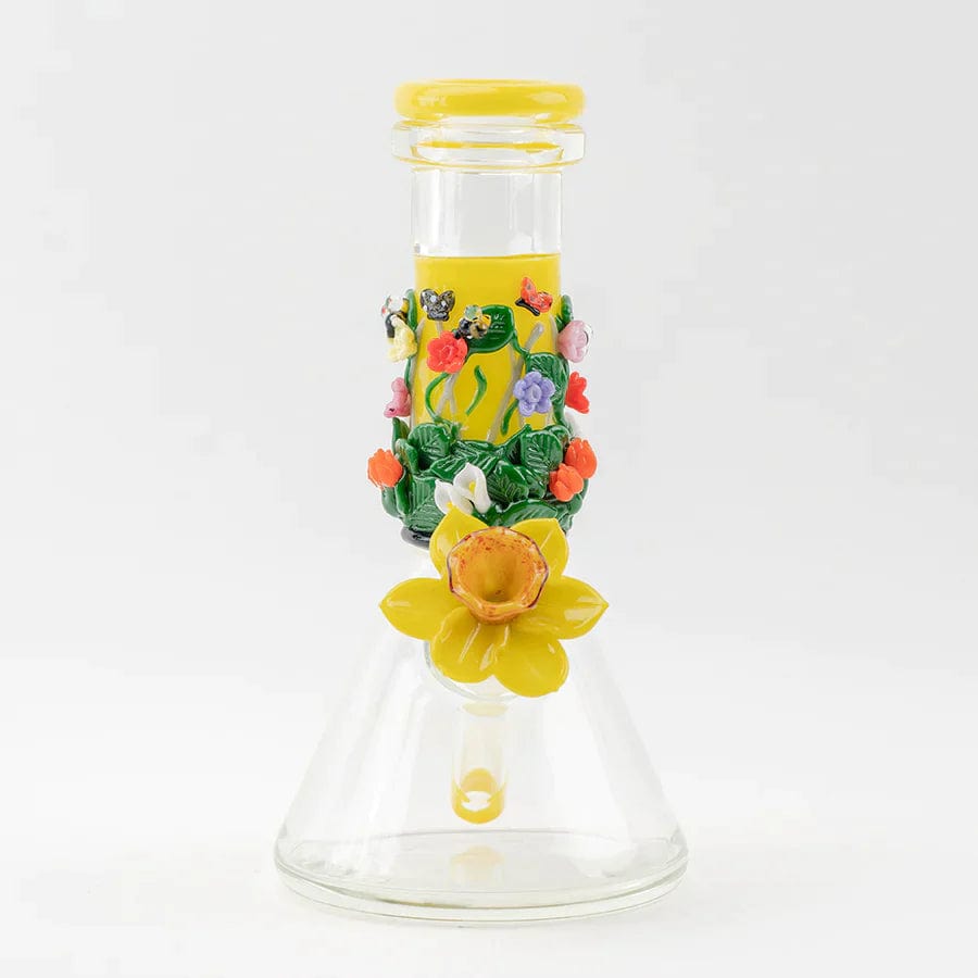 A front view of the Sunshine Garden Beaker Water Pipe, decorated with sculpted flowers around its clear glass body.