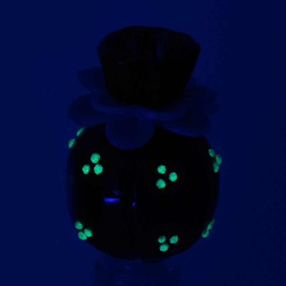 Front view of the UV Peyote Bowl Piece, showcasing its smooth glass construction and unique, rounded shape.