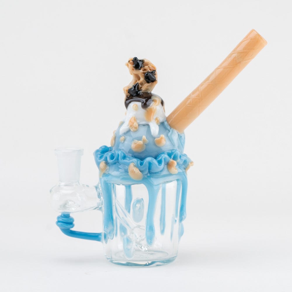 Front three-quarter view of the Cookie Monster Sundae Nano Rig showing a blue dripped glass sundae with a tan wafer straw.